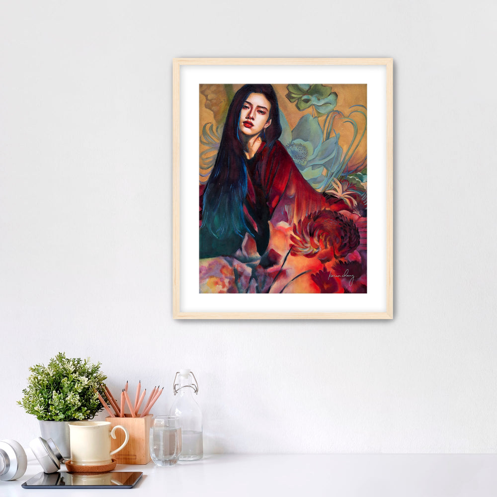 Framed artwork of a person with a colorful background on a white wall.