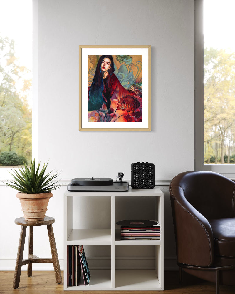 Framed artwork on a wall above a record player and vinyls in a room with a window view.