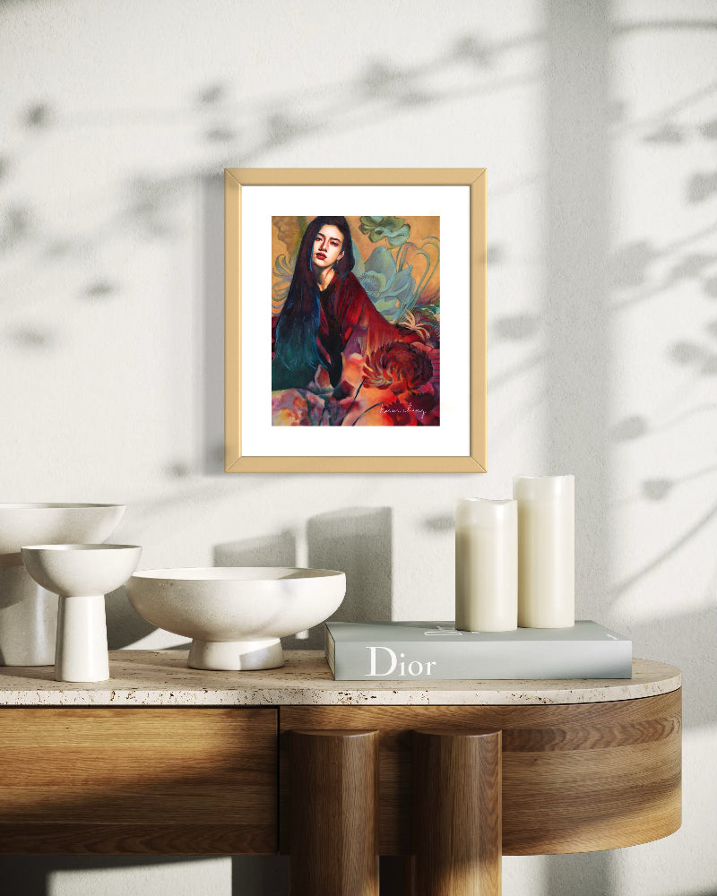 Framed artwork on a table with decorative items