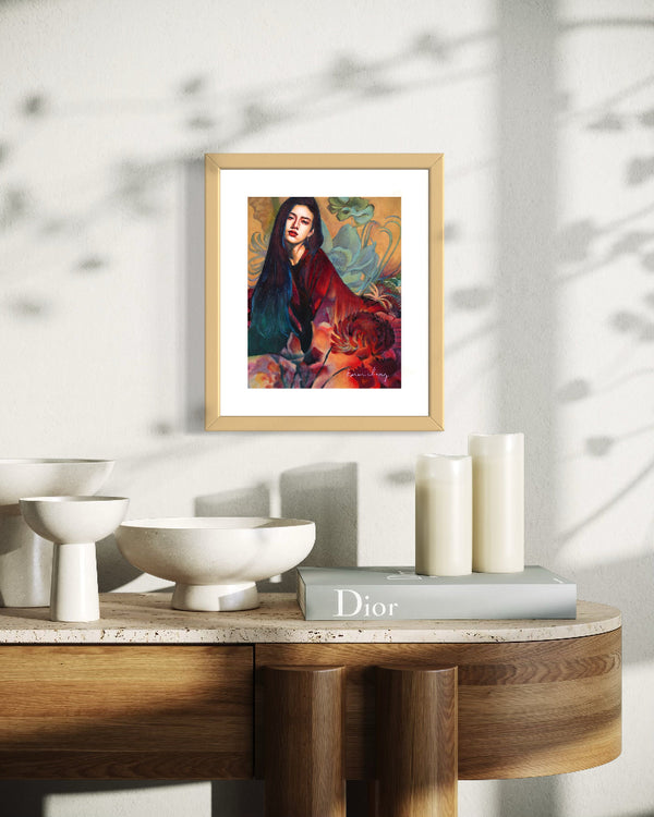 Framed artwork on a table with decorative items