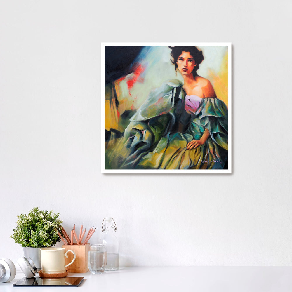 Framed painting of a woman in a green dress on a white wall with decor items below.