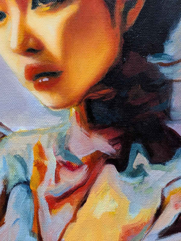 Close-up of a person wearing a colorful garment with a blurred background