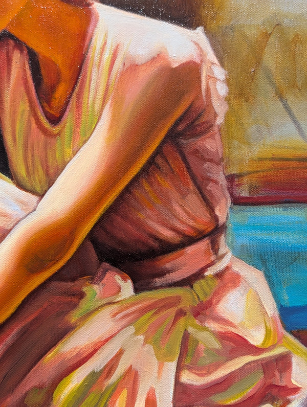 Close-up of a person wearing a patterned dress with a blurred background