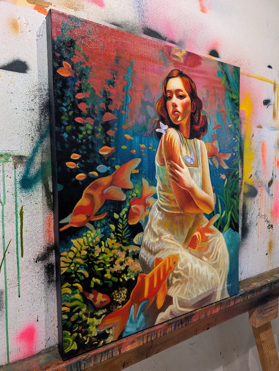 Artistic depiction of a woman surrounded by goldfish in an underwater scene, with graffiti in the background.