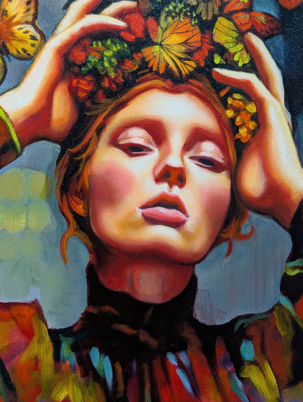 Colorful artwork of a woman's face with flowers and butterflies