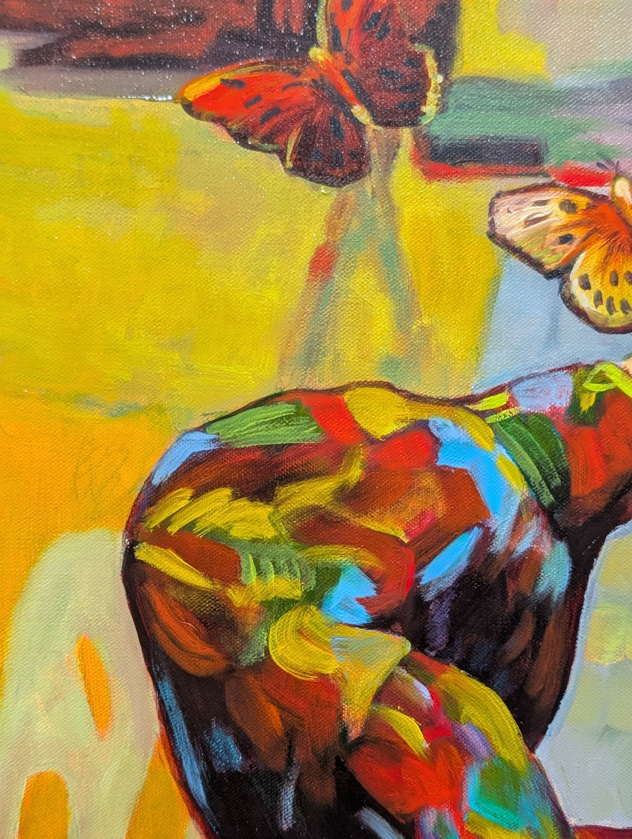 Colorful abstract painting with butterfly-like shapes on a yellow background