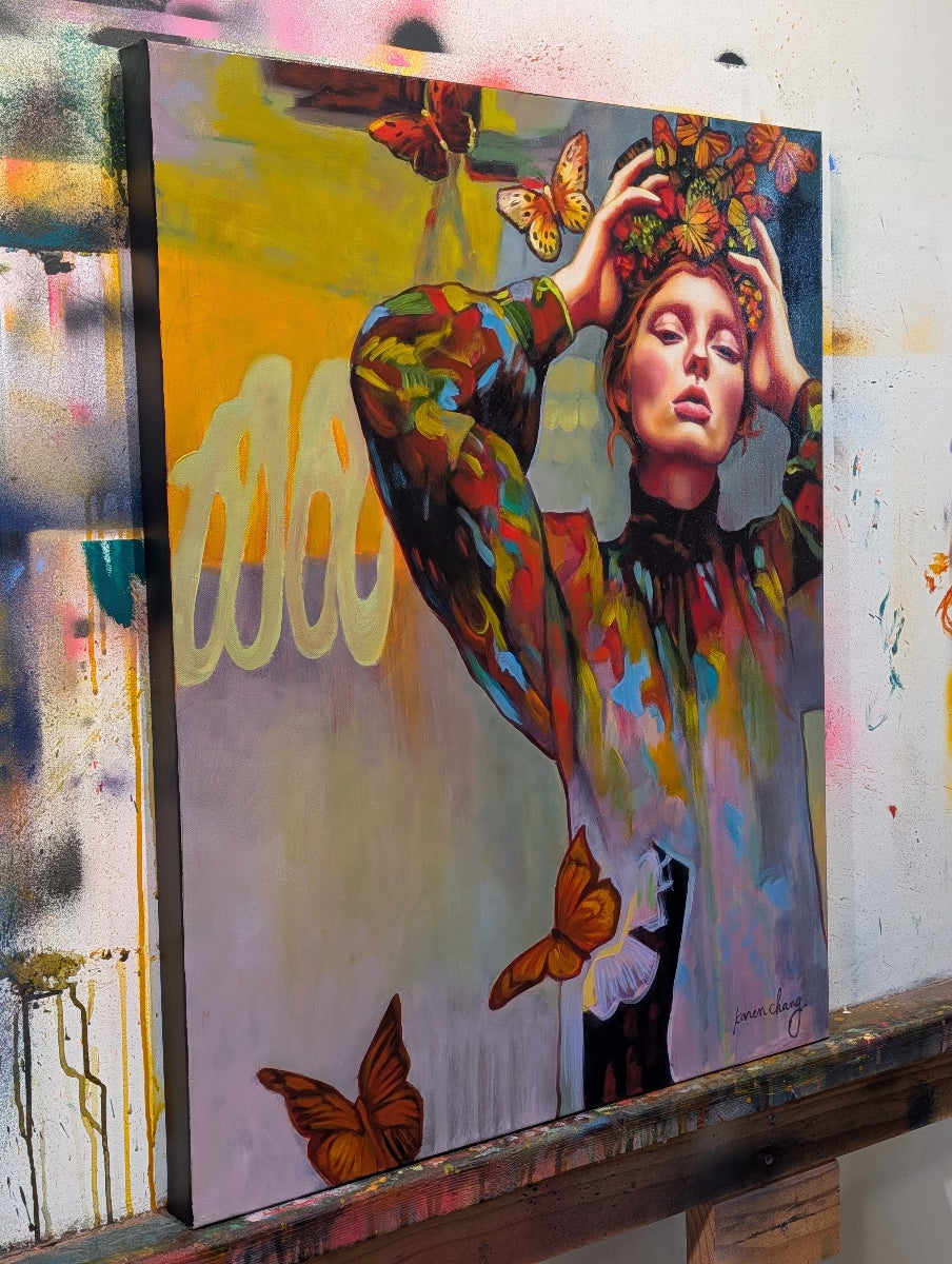Colorful painting of a woman with butterflies on a textured wall.