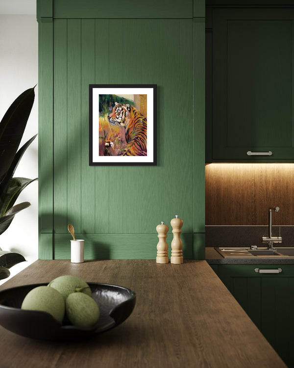 Kitchen interior with a tiger painting on a green wall, apples in a bowl on a wooden counter.