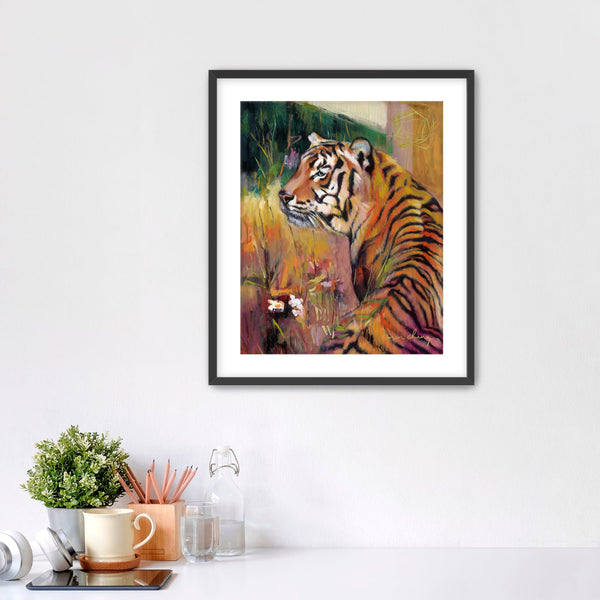 Framed painting of a tiger on a wall above a desk with office supplies.