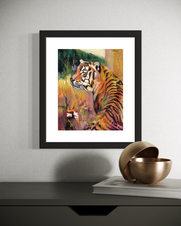 Framed painting of a tiger on a wall above a shelf with decorative items.