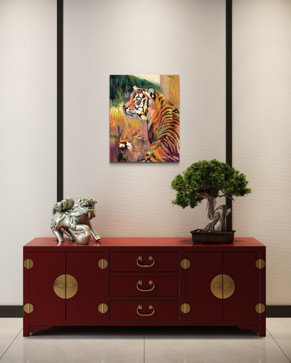 Red cabinet with gold accents in a room with a painting of a tiger and decorative items.