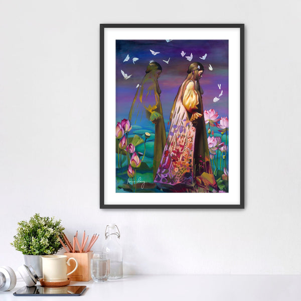 Framed artwork of two people in a garden with butterflies on a white wall.