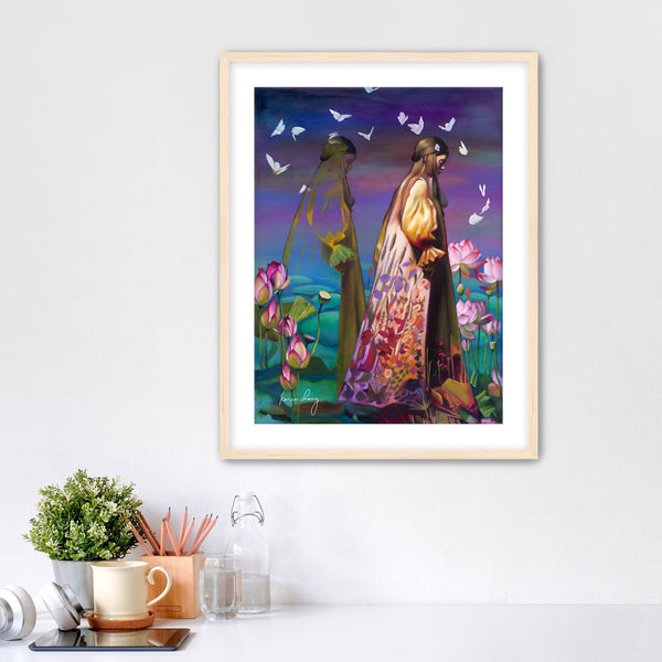 Framed artwork of two people in a garden with flowers and butterflies on a white wall.