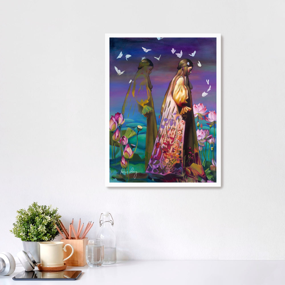 Framed artwork of two people in a garden with flowers and butterflies on a white wall.