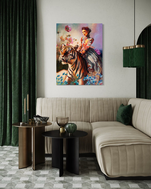 Living room with a beige sofa, side tables, and a painting of a woman with a tiger on the wall.
