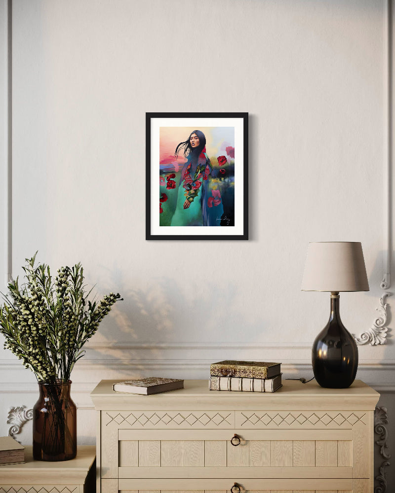 Framed artwork of a woman with flowers on a wall above a cabinet with decorative items.