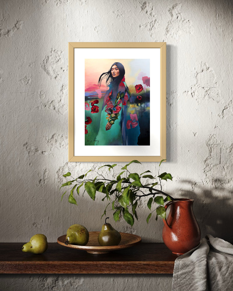 Framed artwork of a woman in a floral dress hanging on a textured wall with a shelf below.