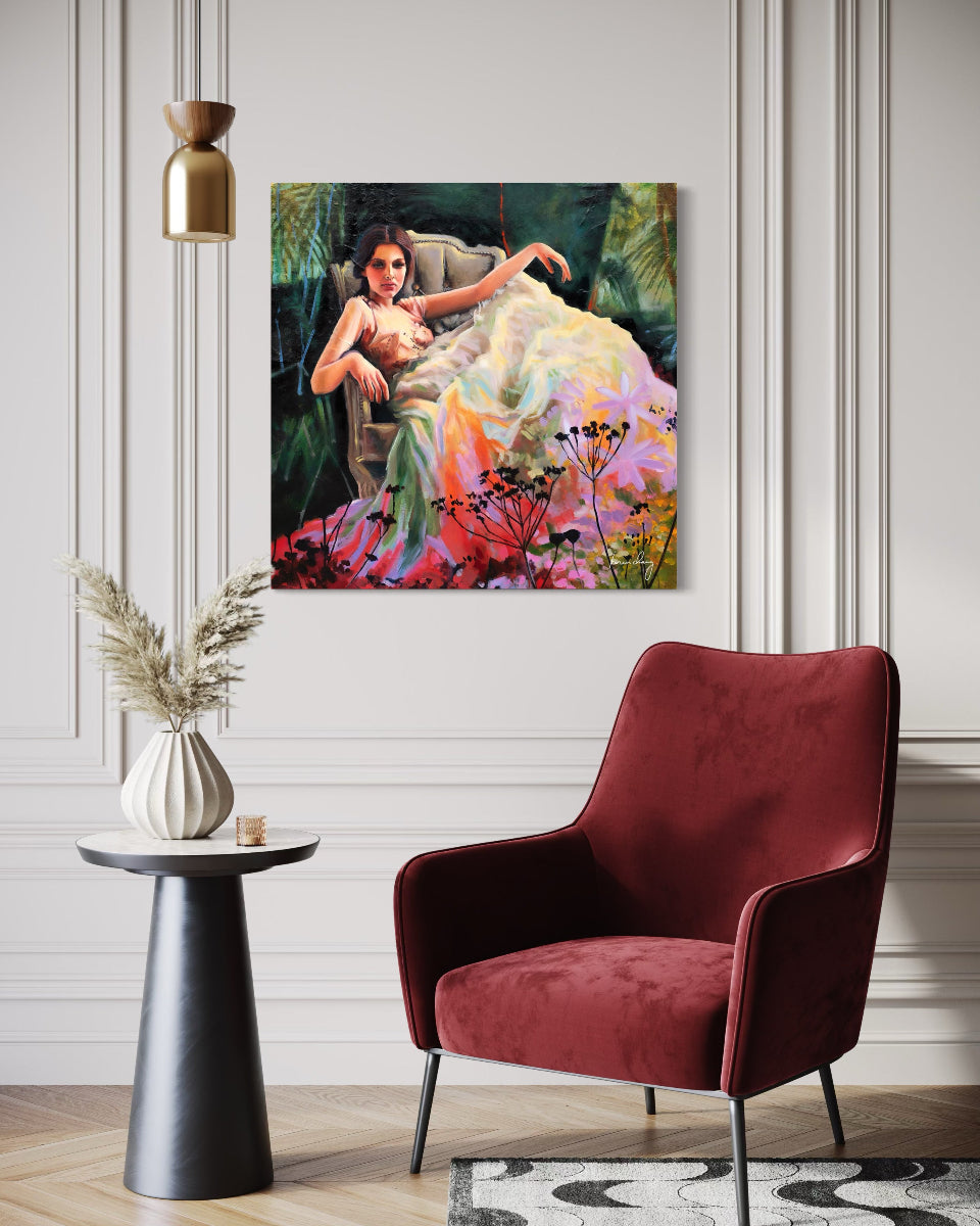 Modern interior with a red armchair, side table, and painting on the wall.