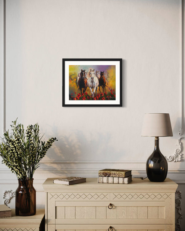 Framed artwork of horses on a wall above a decorative cabinet with a lamp and books.