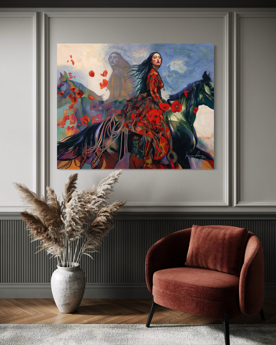 Framed painting of a woman in a red dress with flowers on a wall above a brown armchair and vase with pampas grass.