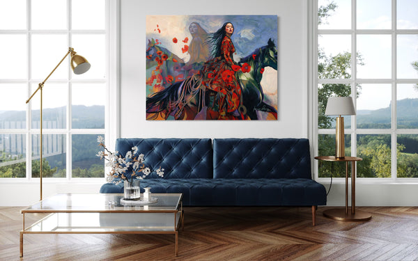 Modern living room with a blue sofa, artwork on the wall, and decorative elements.