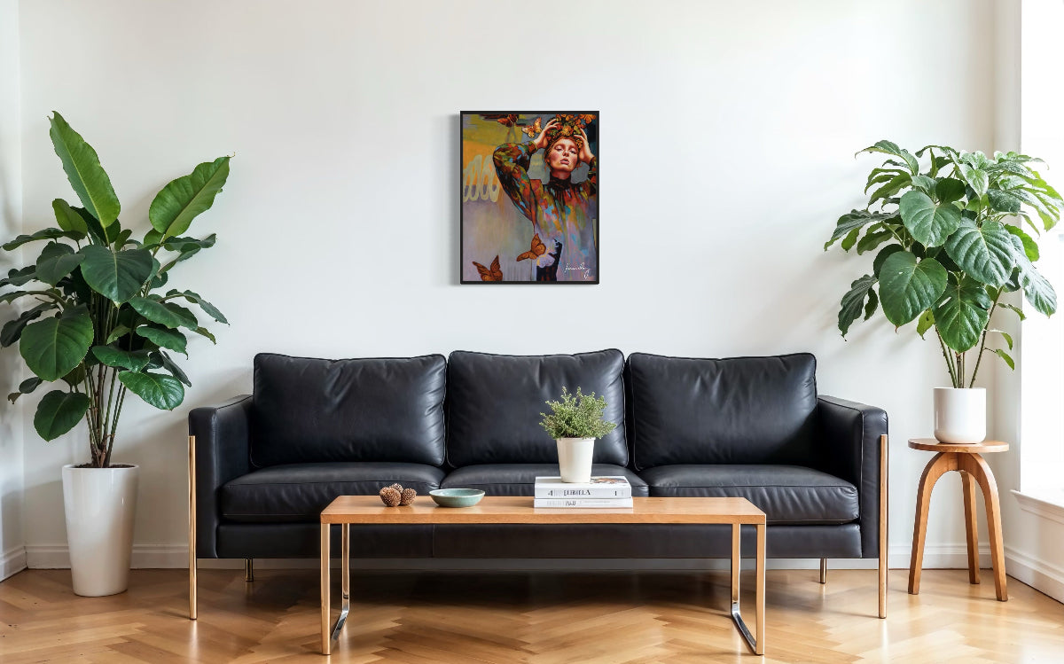 Modern living room with a black leather sofa, wooden coffee table, and decorative plants.