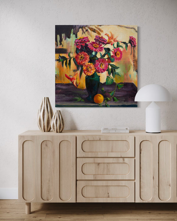 Floral painting above a wooden cabinet with decorative items.