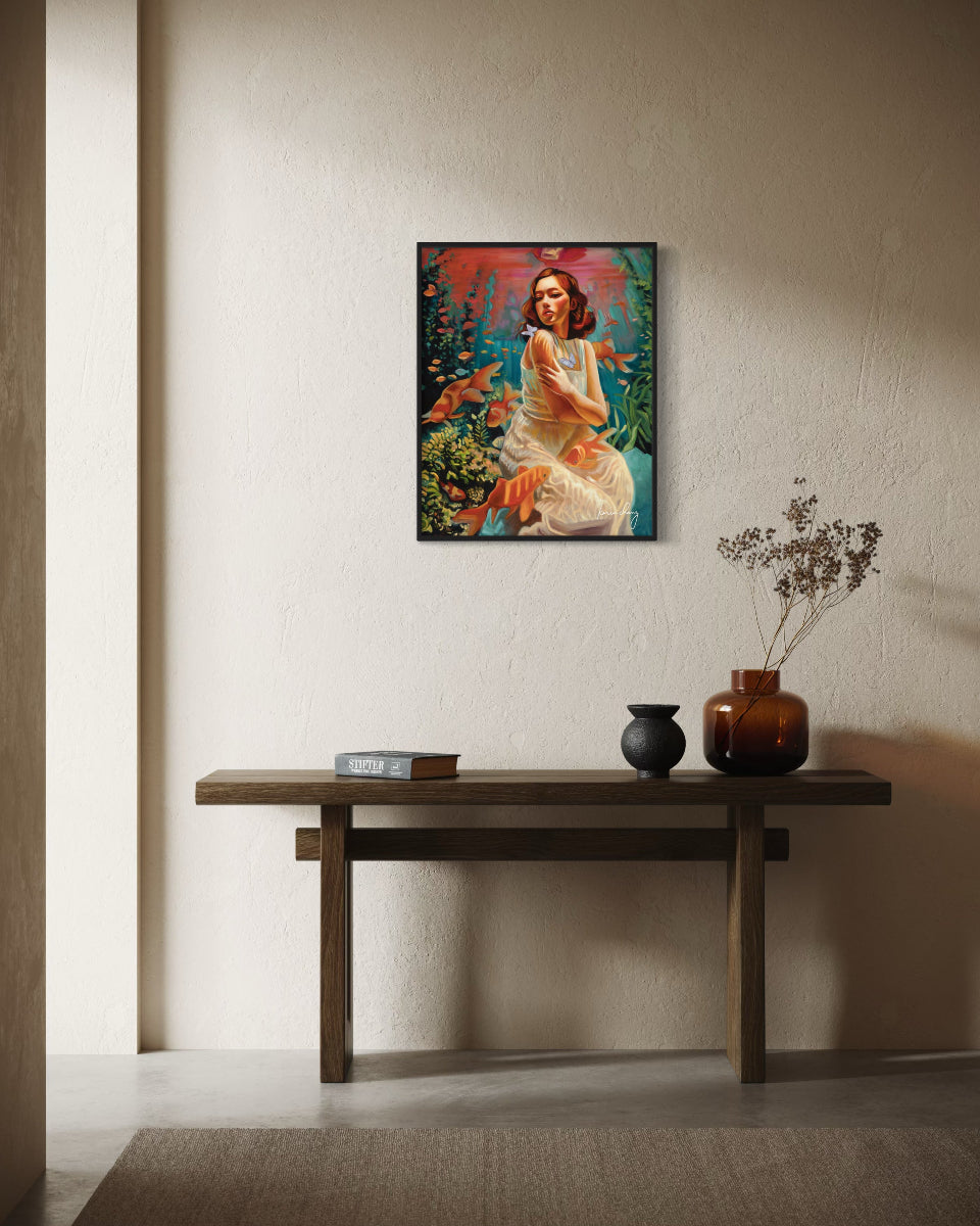 Framed artwork on a wall above a wooden console table with decorative items.
