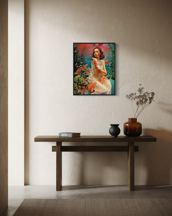 Framed artwork on a wall above a wooden console table with decorative items.